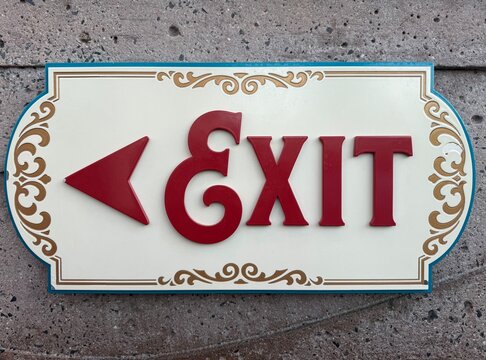 Exit Sign: A universally recognized "EXIT" sign, typically illuminated, indicating a way out of a building or area.