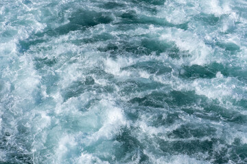 Waves coming out of the rear of a ship