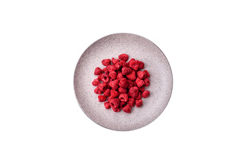 Dried sublimated slices of raspberry as an ingredient for sweet desserts. Dried raspberry