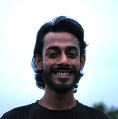 Close looking young male happy face with nice hair style