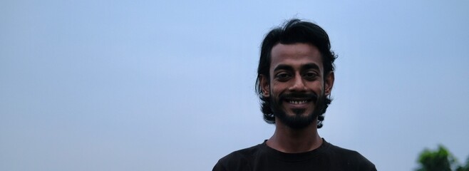 Smile face asian adult male with blue sky background
