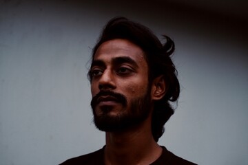 Portrait of a south asian man with a beard