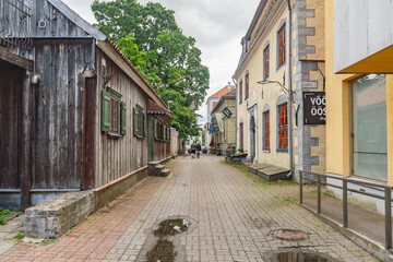 Old town street after the rain with traditional old historic houses in Parnu, Estonia, Europe