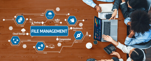 Explore modern file management strategies illustrated in a collaborative workspace. This image showcases teamwork, technology, and effective data organization methods. Amity