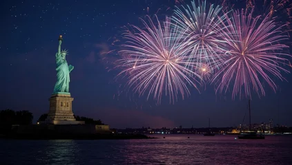Papier peint photo Statue de la Liberté Statue of liberty illuminated with fireworks display over water at night in new york city harbor  © Abuzar