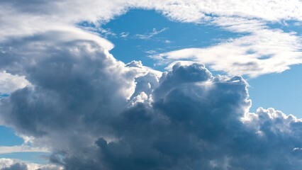 Dramatic cumulus clouds in blue sky