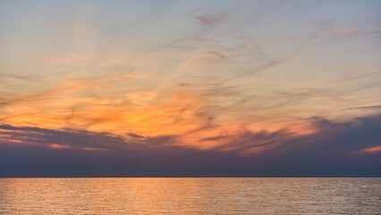 Beautiful sunset sky over the sea with colorful clouds