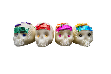 Row of Four Small Sugar Skulls with Colored Foil Transparent Background