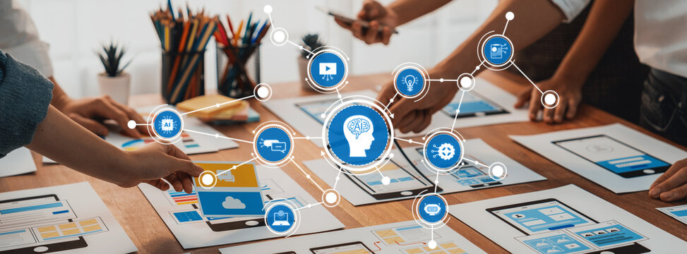 Creative Team Collaborating on Artificial Intelligence Concepts with Visual Graphics and Digital Technology in a Modern Workspace. Amity