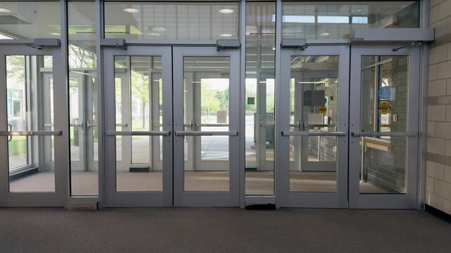 The empty entrance or exit of an American school. Internal view of educational building.