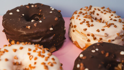A vibrant selection of assorted donuts with various toppings and glazes, perfect for bakeries, cafés, or dessert promotions. Professional food photography with bright lighting