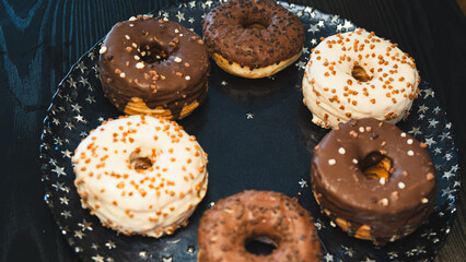 A vibrant selection of assorted donuts with various toppings and glazes, perfect for bakeries, cafés, or dessert promotions. Professional food photography with bright lighting