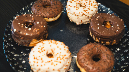 A vibrant selection of assorted donuts with various toppings and glazes, perfect for bakeries, cafés, or dessert promotions. Professional food photography with bright lighting