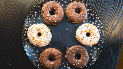 A vibrant selection of assorted donuts with various toppings and glazes, perfect for bakeries, cafés, or dessert promotions. Professional food photography with bright lighting