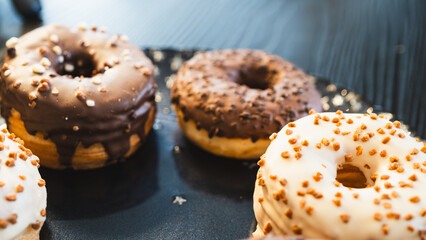 A vibrant selection of assorted donuts with various toppings and glazes, perfect for bakeries, cafés, or dessert promotions. Professional food photography with bright lighting