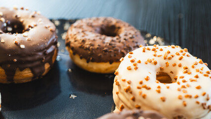 A vibrant selection of assorted donuts with various toppings and glazes, perfect for bakeries, cafés, or dessert promotions. Professional food photography with bright lighting
