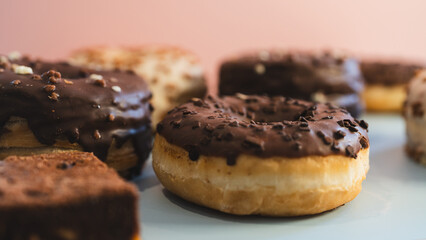 A vibrant selection of assorted donuts with various toppings and glazes, perfect for bakeries, cafés, or dessert promotions. Professional food photography with bright lighting