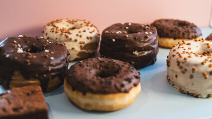 A vibrant selection of assorted donuts with various toppings and glazes, perfect for bakeries, cafés, or dessert promotions. Professional food photography with bright lighting