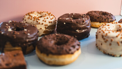 A vibrant selection of assorted donuts with various toppings and glazes, perfect for bakeries, cafés, or dessert promotions. Professional food photography with bright lighting