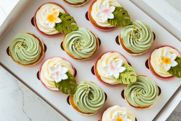 Assortment of pistachio flavor Cupcakes in a gift box on white background