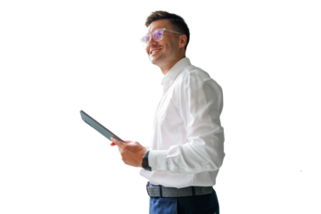 Professional man smiles while holding a tablet, embodying confidence and creativity