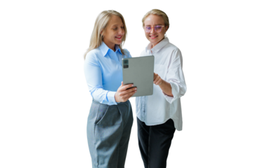 Two women professionals engaged in a collaborative discussion while reviewing information on a tablet