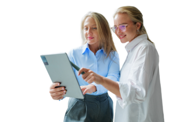 Two professional women collaborating and discussing ideas while reviewing a tablet together