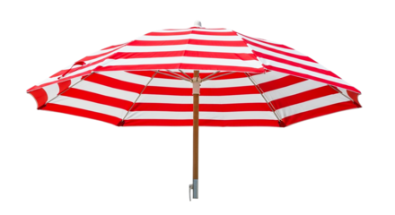 A vibrant beach umbrella with red and white stripes providing shade against a scene outdoors