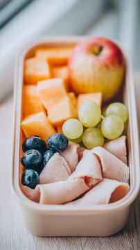 Healthy lunchbox with fruits and turkey slices for back to school  