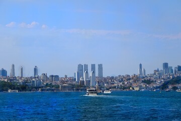 Obraz premium View of the Bosphorus. Maiden's Tower and the 15th of July Bridge. Tourism destination. Ships passing through the Bosphorus. Istanbul - Turkey.