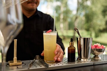 Bartender Preparing Cocktails at a Bar Counter	