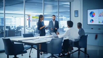 Diverse team collaborating on business strategies in a modern office environment analyzing growth - Powered by Adobe