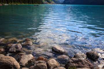 Iconic turquoise Lake Louise in Banff National Park, framed by the Victoria Glacier and majestic Rocky Mountains.