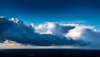 Fototapeta premium dramatic sky with contrast between bright blue and incoming storm clouds for weather climate change and cinematic background