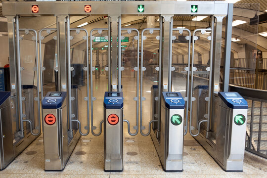 Modern Fare Gates New fare gates installed in a Bay Area public transit station. The design reflects updates in security, accessibility, and commuter experience within the urban transportation system. - Powered by Adobe