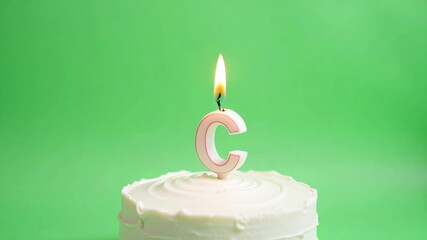 Celebrate milestones with this delightful birthday cake featuring a glowing candle, perfect for capturing joyous moments and special occasions.