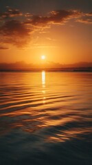 Naklejka premium Sunset over calm sea golden reflections serene vertical mobile wallpaper
