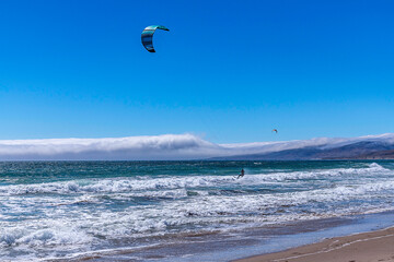 Lompoc, CA, USA &ndash; August 13, 2025: Kitesurfers take advantage of the high winds on the Pacific Ocean at Jalama Beach in Lompoc, CA.