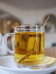 Glass of tea with a spoon in it