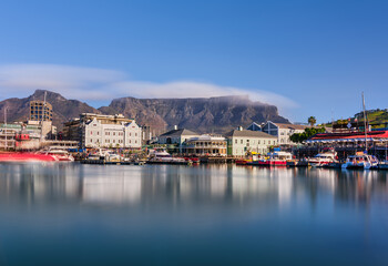 Close-up long exposure of V and A Waterfront with clouds passing over Table Mountain, South Africa