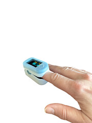 Pulse oximeter on finger measuring blood oxygen saturation, isolated close-up