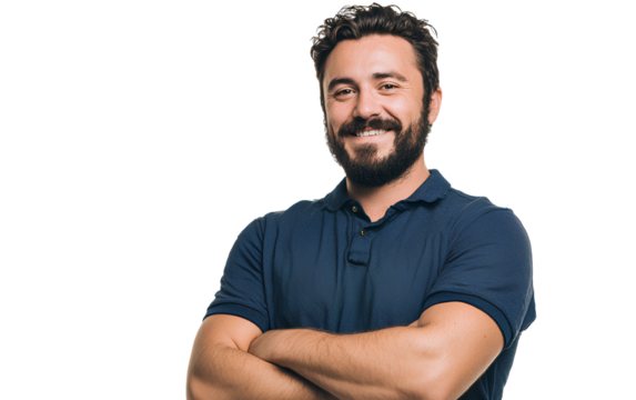 A handsome, smiling man with dark hair and a beard, wearing a blue polo shirt, stands in front of a white background with his arms crossed.