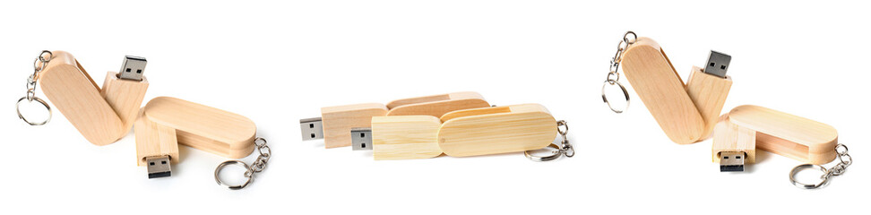 Set of wooden flash drivers on white background