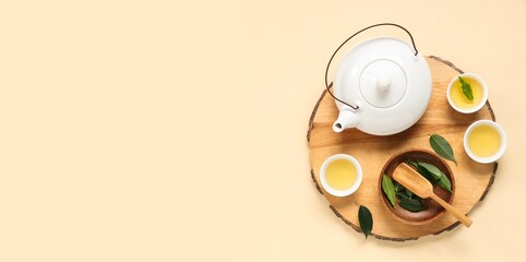 Composition with hot tea on beige background with space for text, top view