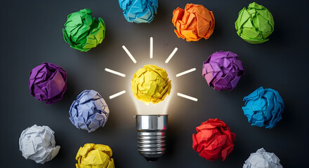 Bright idea shines amidst colorful brainstorming balls