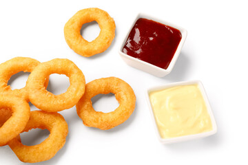 Fried breaded onion rings with ketchup and mayonnaise on white background
