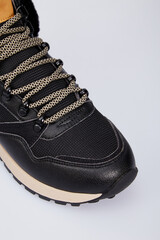 Women's fashion winter high-top sneaker with laces isolated on white background. Sports leather boot lace up for female. Luxury footwear mock up, template. Flat lay, top view, toe close-up, toe detail