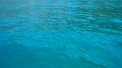 Experience the serene beauty of the Adriatic Sea with waves gently lapping against the boat side, inviting travelers to explore Montenegro captivating coastal treasures amidst stunning azure waters