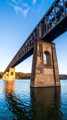 Fototapeta premium Steel bridge over tranquil water