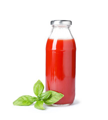 Tasty juice in glass bottle and basil isolated on white